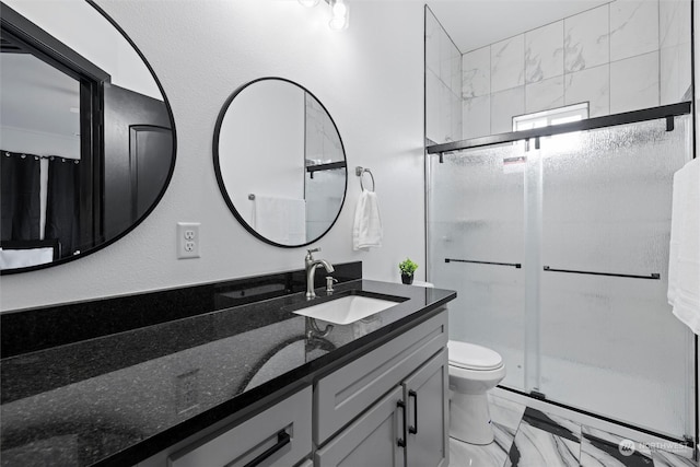 205 Clayton Pl, Mattawa, WA 99349 - bathroom with marble look tiles, a stall shower, toilet, and vanity