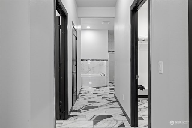 205 Clayton Pl, Mattawa, WA 99349 - hall featuring light marble finish floors and baseboards