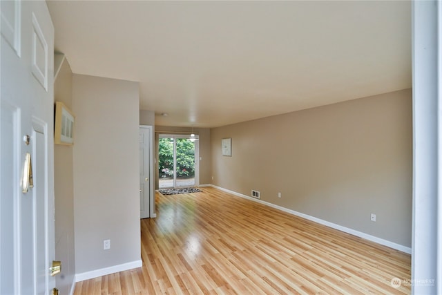 unfurnished room featuring light hardwood / wood-style flooring