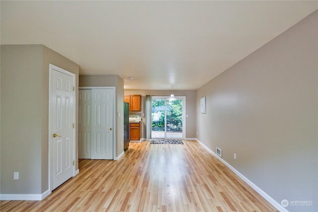 spare room with light wood-type flooring