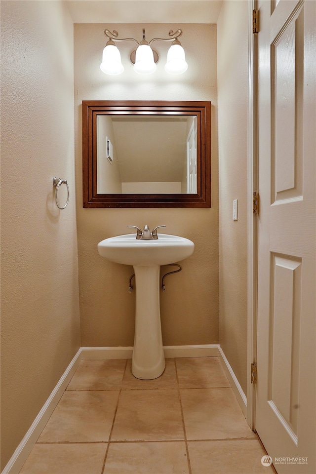 bathroom with tile patterned flooring