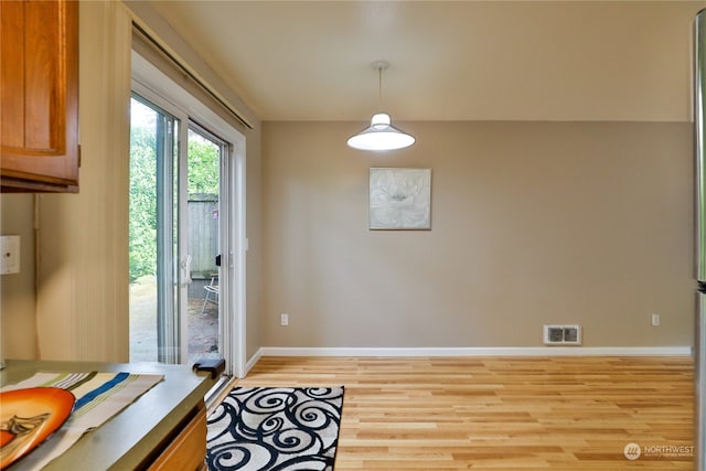 entryway with light hardwood / wood-style flooring