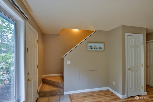 foyer entrance with light wood-type flooring