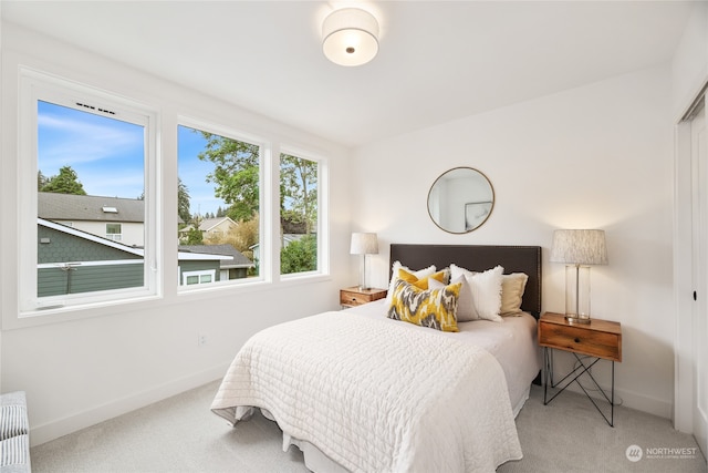 carpeted bedroom featuring radiator