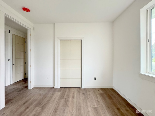 unfurnished bedroom with light hardwood / wood-style flooring