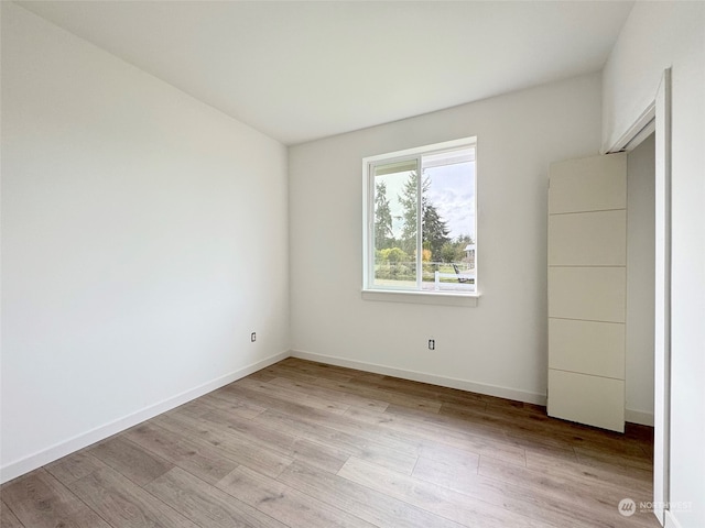 empty room with light hardwood / wood-style floors