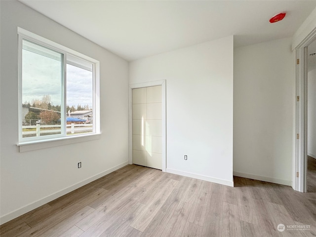 unfurnished bedroom featuring light hardwood / wood-style floors