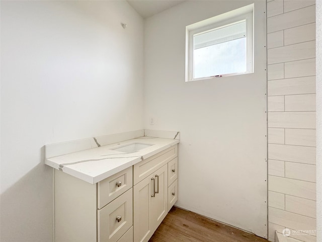 bathroom featuring vanity and hardwood / wood-style flooring