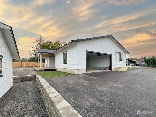 property exterior at dusk with a garage