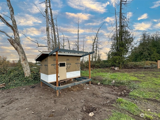 view of outdoor structure at dusk