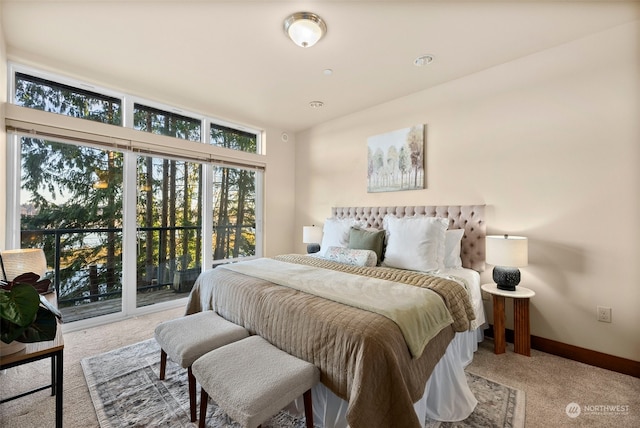 bedroom with light colored carpet and access to exterior