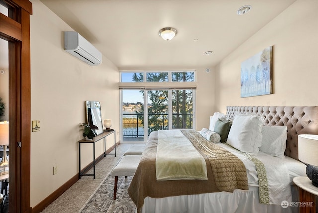 carpeted bedroom with a wall unit AC