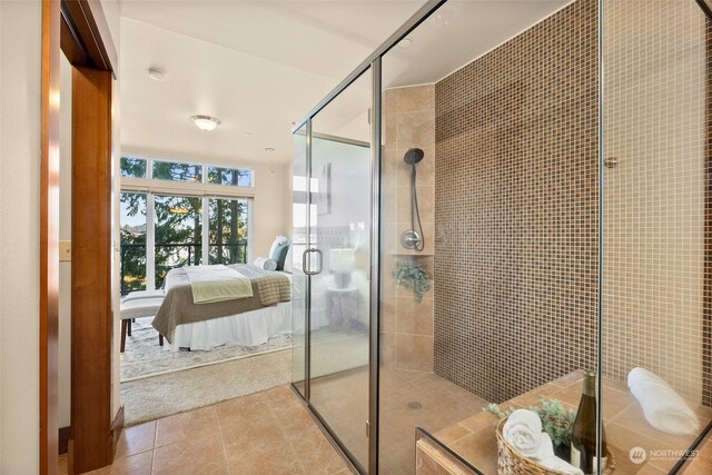 bathroom with walk in shower and tile patterned floors