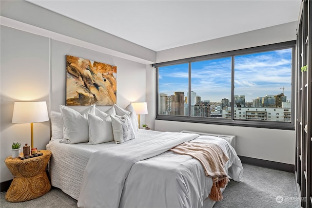 carpeted bedroom featuring multiple windows