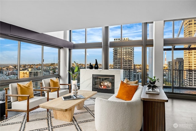 sunroom / solarium featuring a high end fireplace