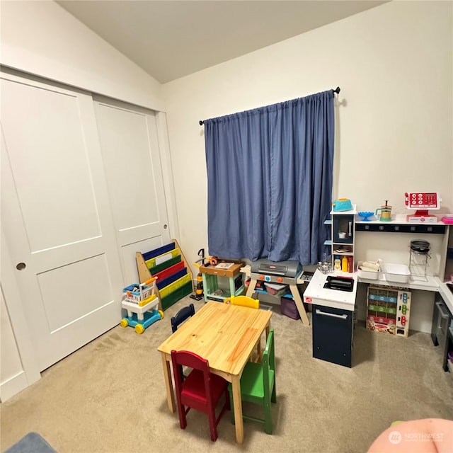 game room featuring vaulted ceiling and carpet floors