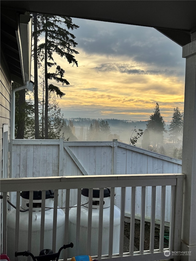 view of balcony at dusk