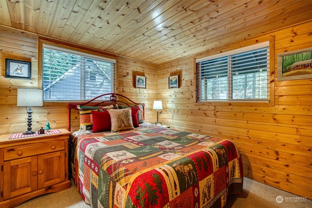 carpeted bedroom featuring wooden walls and wooden ceiling