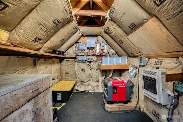 unfinished attic featuring heating unit