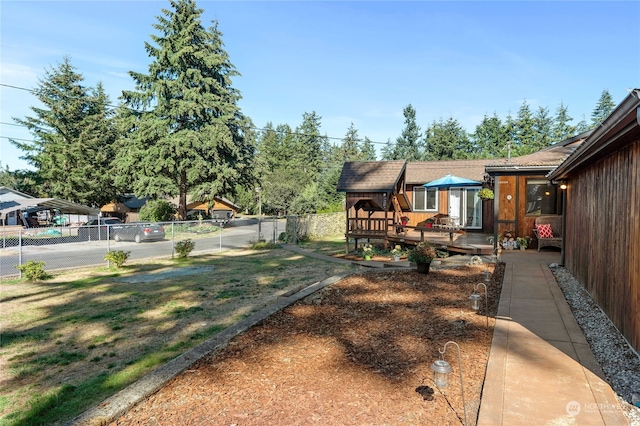 view of yard featuring a deck