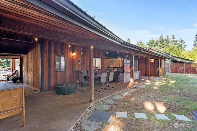 back of house with a patio area and fence