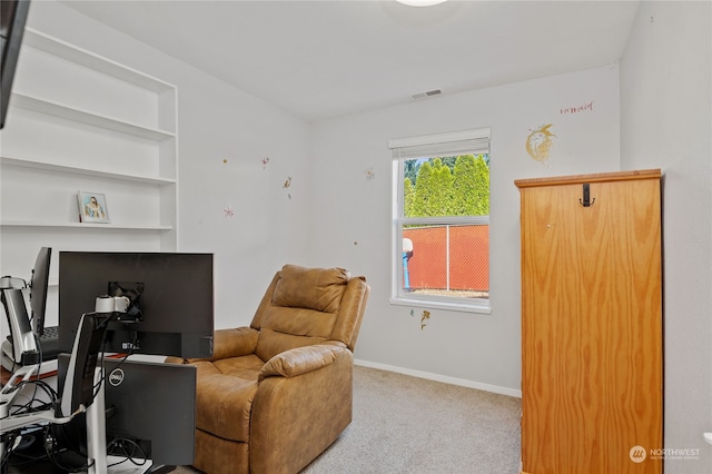 office area featuring built in features, carpet, visible vents, and baseboards