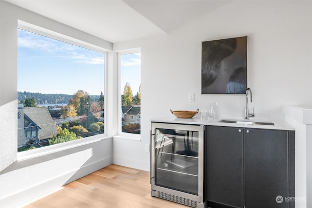 4127 48th Ave S, Seattle, WA 98118 - bar with beverage cooler, sink, and light wood-type flooring