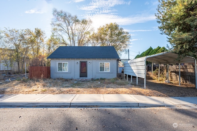 view of front of home with a carport