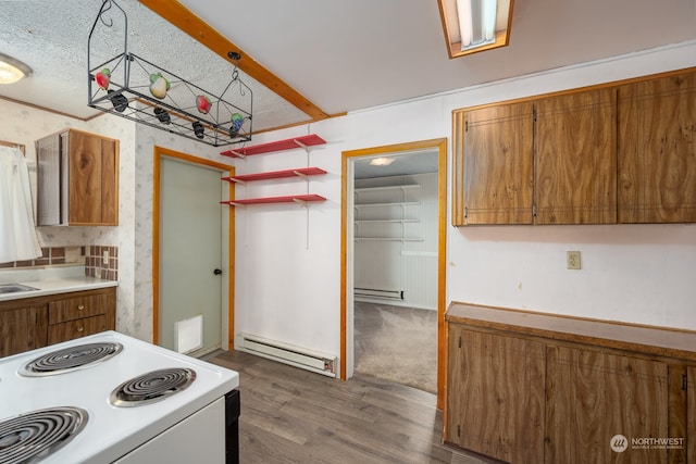 kitchen featuring dark wood-type flooring, beam ceiling, a baseboard radiator, and electric stove