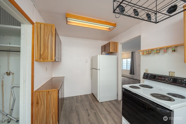 kitchen with a baseboard heating unit, light hardwood / wood-style flooring, a skylight, and white appliances