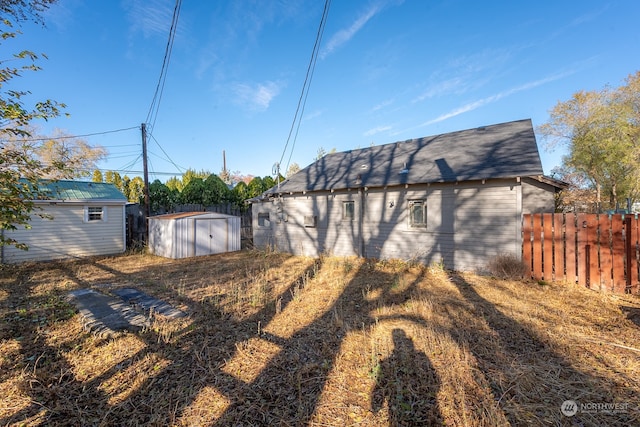 view of side of property featuring a shed