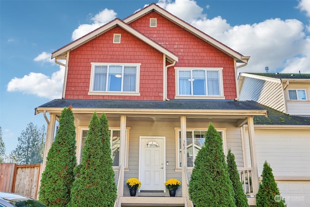 view of front of house with a garage and covered porch