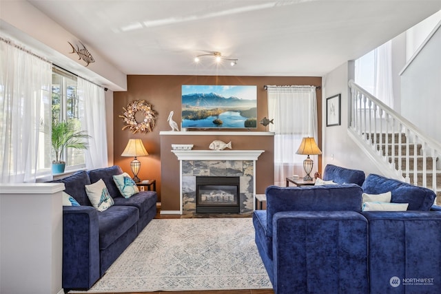 living room with a stone fireplace