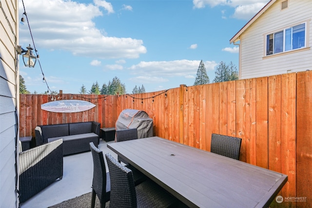 view of patio featuring area for grilling and an outdoor hangout area