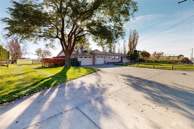 single story home with a front lawn and a garage