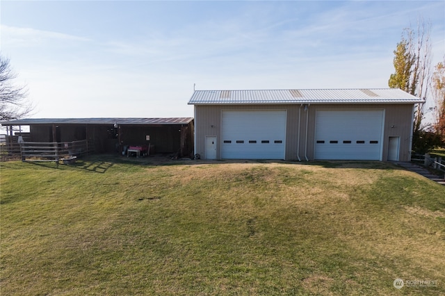 garage with a yard