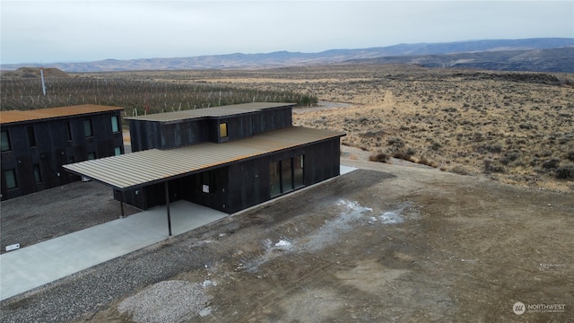 view of front of property with a mountain view