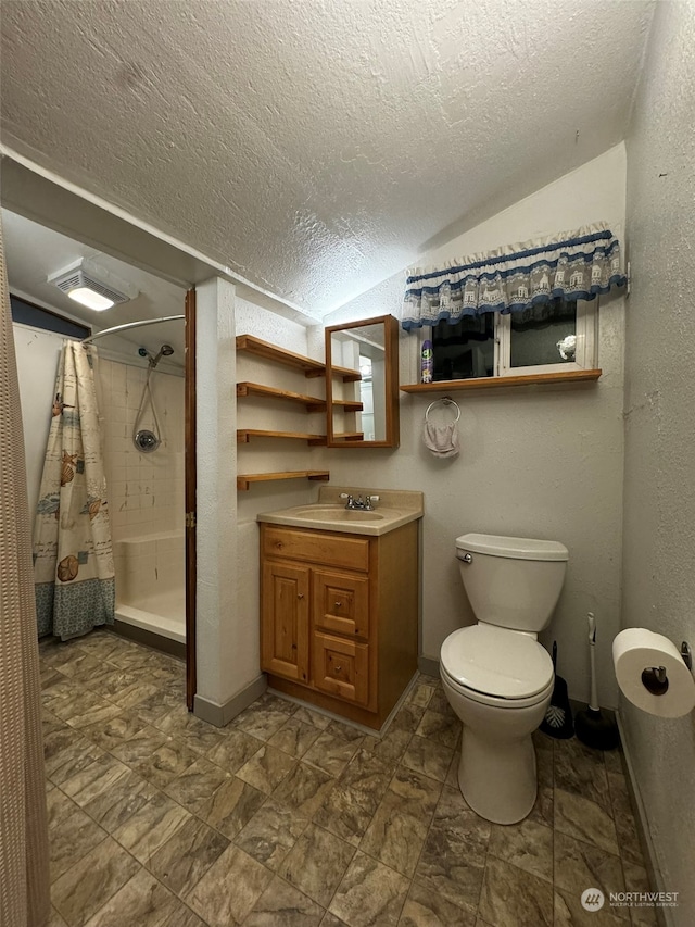 bathroom featuring toilet, vaulted ceiling, curtained shower, a textured ceiling, and vanity