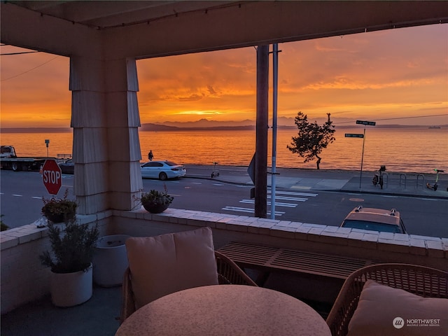 2142 Alki Ave SW Unit 1-5, Seattle, WA 98116 - patio terrace at dusk featuring a water view