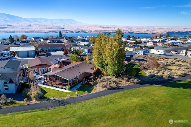 birds eye view of property with a mountain view