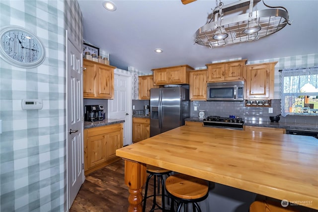 205 Fairway Pl SW, Mattawa, WA 99349 - kitchen with appliances with stainless steel finishes, butcher block countertops, backsplash, dark wood-style flooring, and recessed lighting