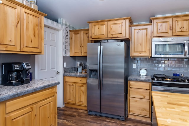 kitchen with butcher block countertops, tasteful backsplash, stainless steel appliances, dark hardwood / wood-style floors, and light brown cabinetry