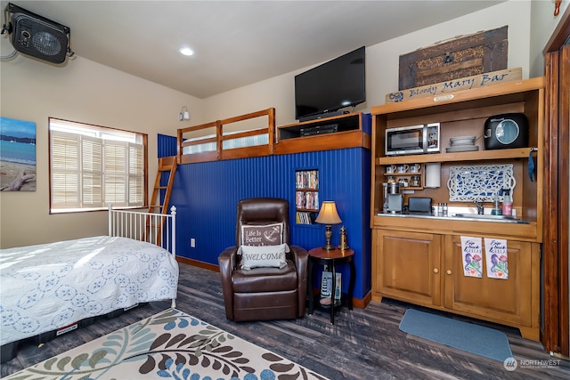 bedroom with dark wood-type flooring