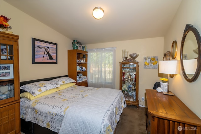 carpeted bedroom featuring vaulted ceiling