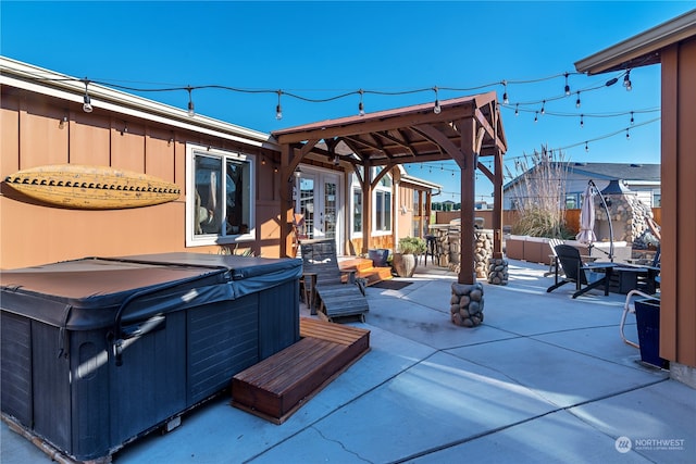 view of patio featuring a hot tub