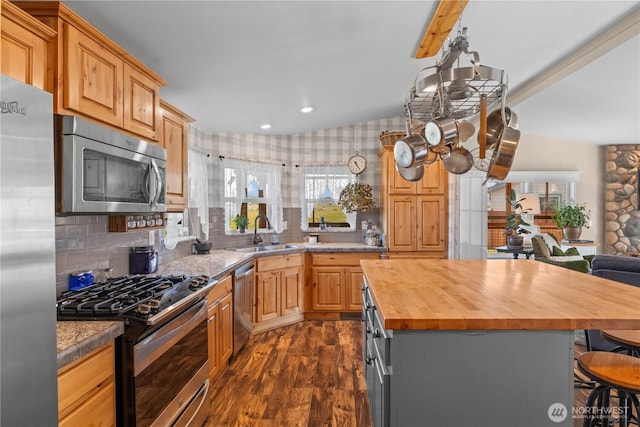 205 Fairway Pl SW, Mattawa, WA 99349 - kitchen featuring stainless steel appliances, wooden counters, a sink, dark wood finished floors, and a kitchen breakfast bar