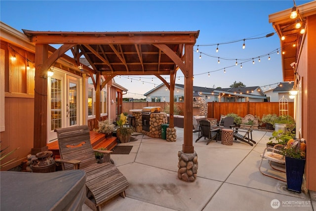 205 Fairway Pl SW, Mattawa, WA 99349 - fenced backyard with area for grilling, a patio, and an outdoor living space with a fire pit