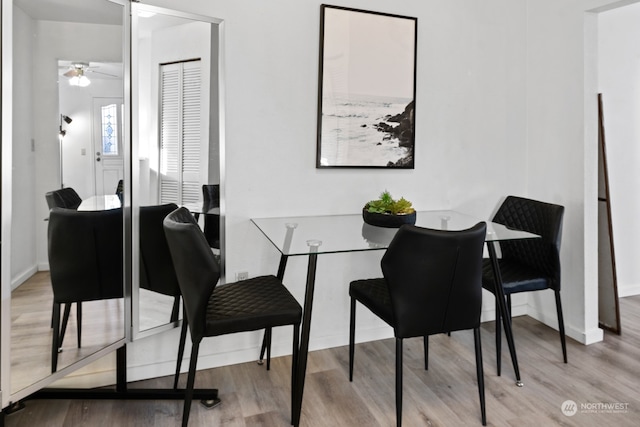 dining room featuring light hardwood / wood-style flooring and ceiling fan