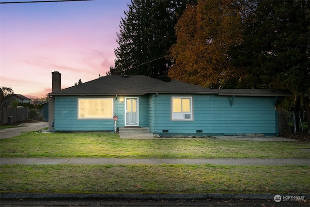 view of front of home featuring a yard