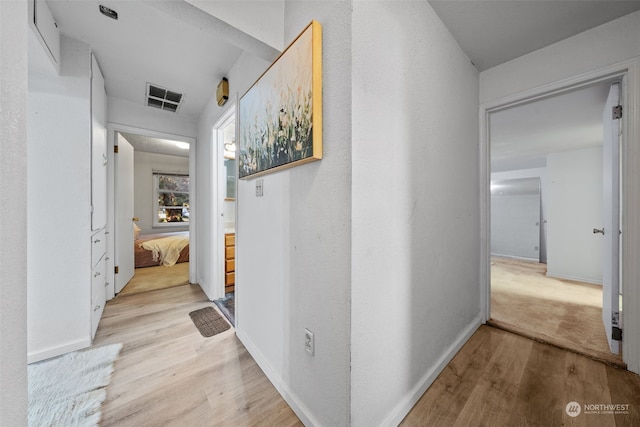 hallway featuring light hardwood / wood-style flooring